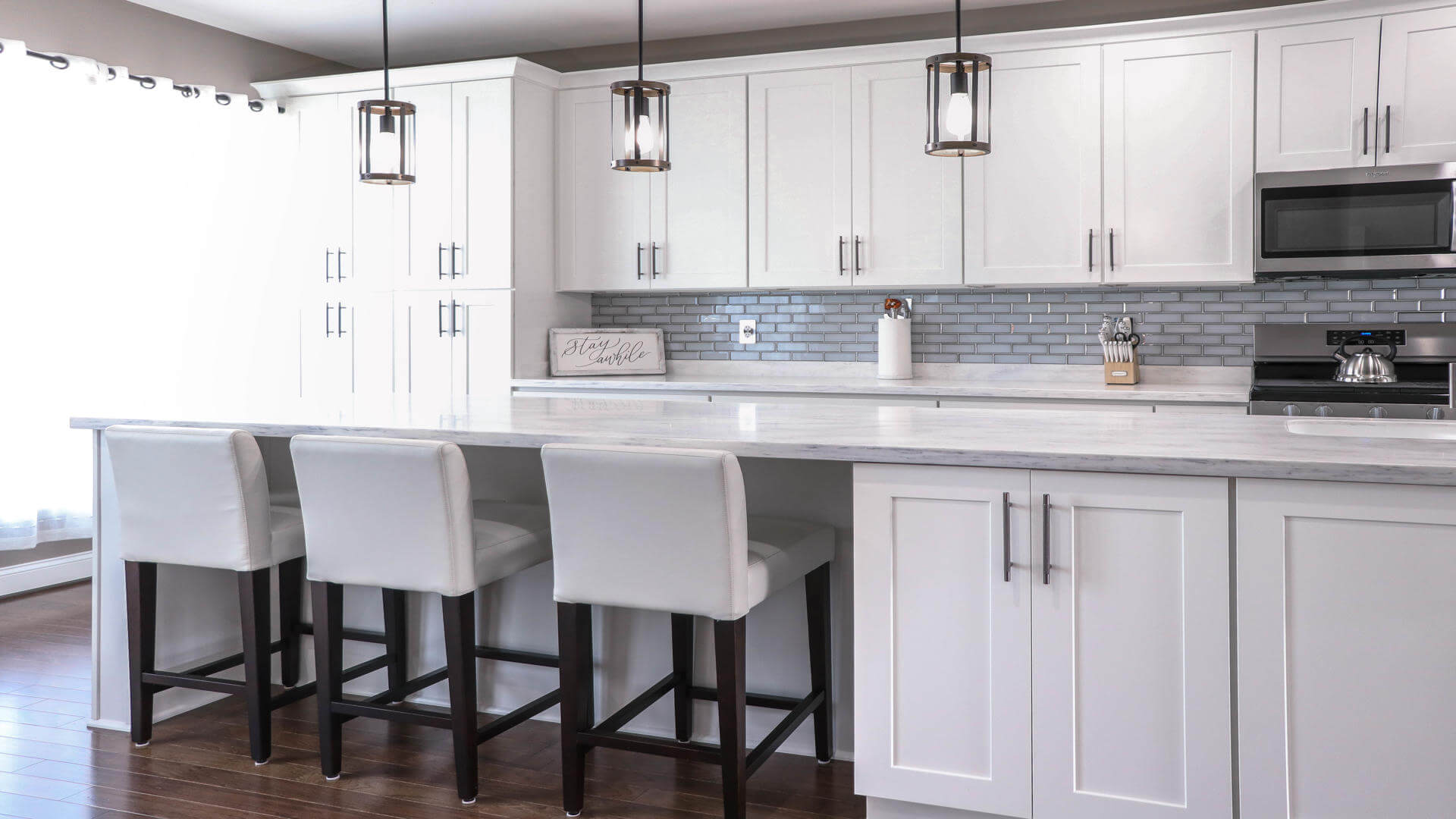 White kitchen cabinets by Kraftsman Cabinetry View 2